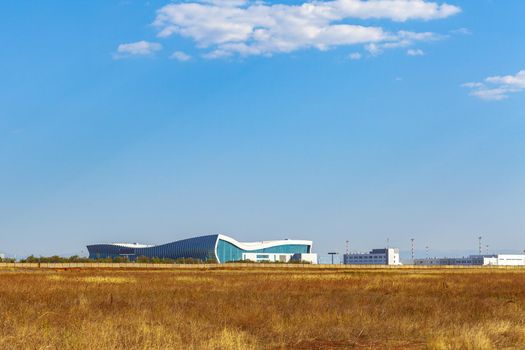 Modern airport terminal building in Russia on sunny day photo