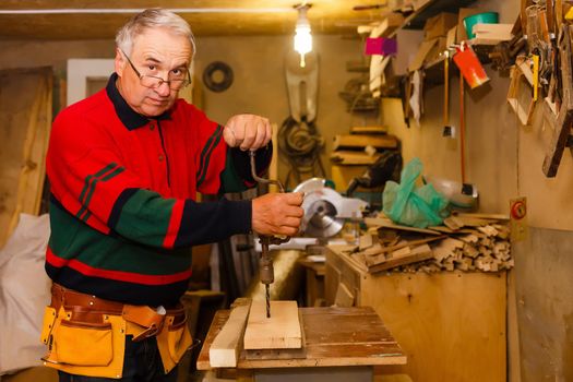 Image of mature carpenter in the workshop