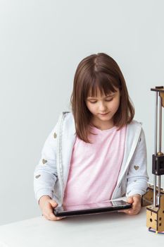 Child with digital tablet. School, technologies and children.