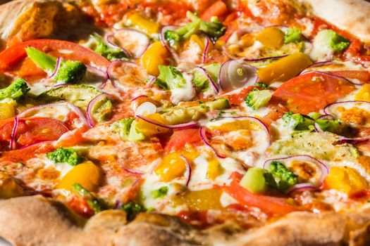 Hot fresh vegetarian pizza on the table. Italian cuisine and dishes.