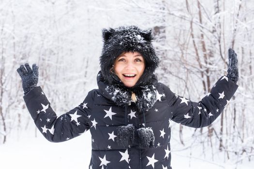 Beautiful young woman winter snowy outdoor portrait