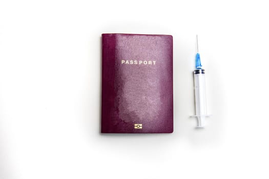 International biometric COVID-19 vaccination passport, syringe traveling in pandemic worlwide concept on white background top view, copy space business