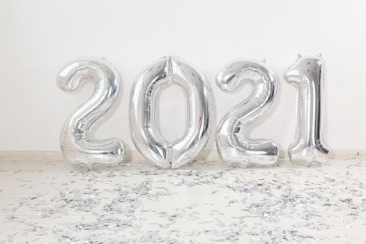 Silver 2021 balloons on white background. New Year celebration