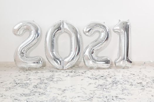 Silver 2021 balloons on white background. New Year celebration