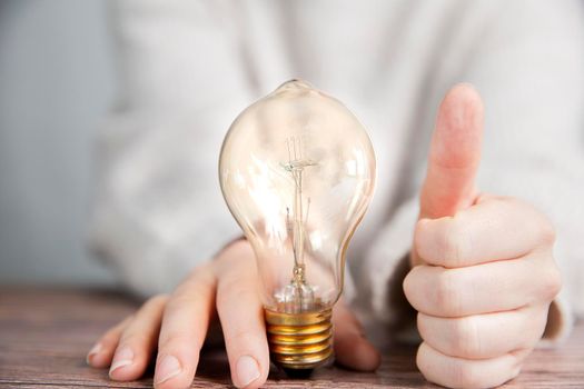 Shining lightbulb with thumbs up, Good Idea and brainstorming, creative business or education concept background modern style retro