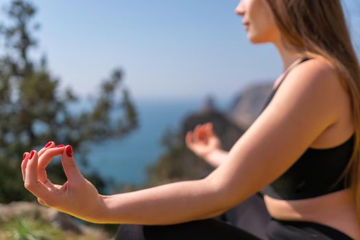 Group of young womans fitness instructor in Sportswear Leggings and Tops, stretching in the gym before pilates, on a yoga mat near the large window on a sunny day, female fitness yoga routine concept.