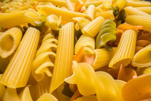 Variety of types and shapes of dry Italian pasta closeup. Food and traditional cuisine.