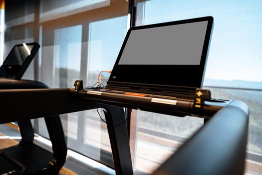 Studio shot of a professional treadmill in a modern gym