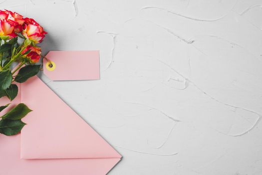 Pink envelope with flowers, top view. Romantic letter. High quality photo