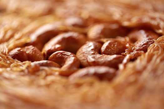 Close up photo of Turkish Baklava dessert with honey and nuts