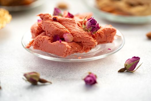 Close up photo of colorful Turkish halva sweets on gray surface