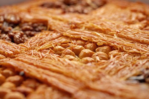 Close up photo of Turkish Baklava dessert with honey and nuts