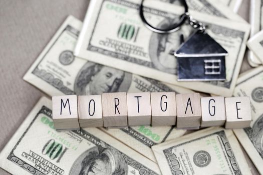 Real Estate Mortgage Loan text With House Keys on money, property,financial,business concept background