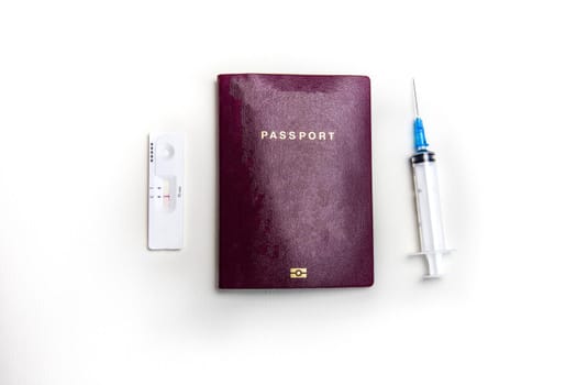 International biometric COVID-19 vaccination passport, syringe and Covid-19 negative test, traveling in pandemic worlwide concept on white background top view, copy space business