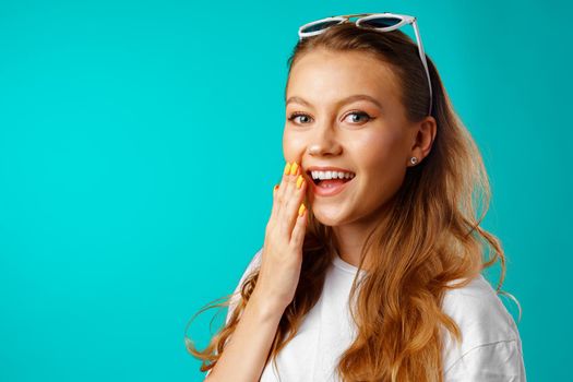 Young attractive cheerful girl laughing with joy close up