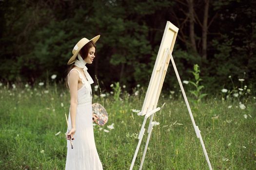 cheerful woman outdoors drawing art landscape hobby. High quality photo