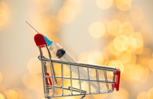 syringe injection in shopping cart for coronavirus vaccine disease, covid-19 or other virus, vaccination shot, medicine and drug concept bokeh background health