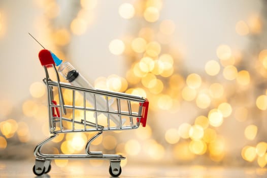 syringe injection in shopping cart for coronavirus vaccine disease, covid-19 or other virus, vaccination shot, medicine and drug concept bokeh background health