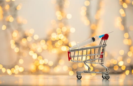 syringe injection in shopping cart for coronavirus vaccine disease, covid-19 or other virus, vaccination shot, medicine and drug concept bokeh background health