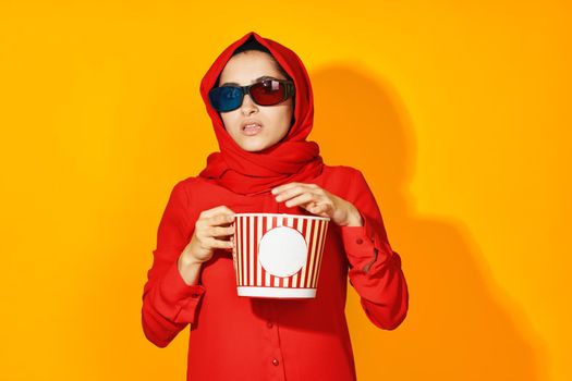 woman in red hijab popcorn entertainment cinema ethnicity model. High quality photo
