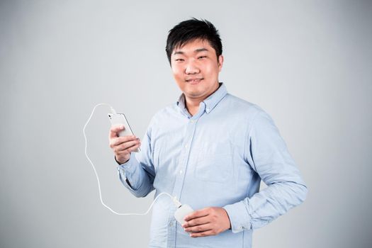 man is charging smartphone good