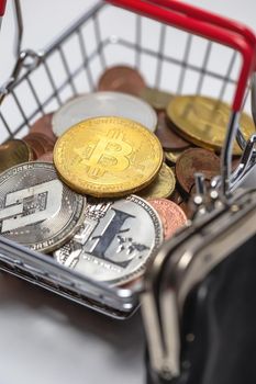 Gold Bitcoin is a cryptocurrency and worldwide payment, Bitcoin, Ethereum, Litecoin in iron shopping basket, Virtual money concept. close up business and financial concept