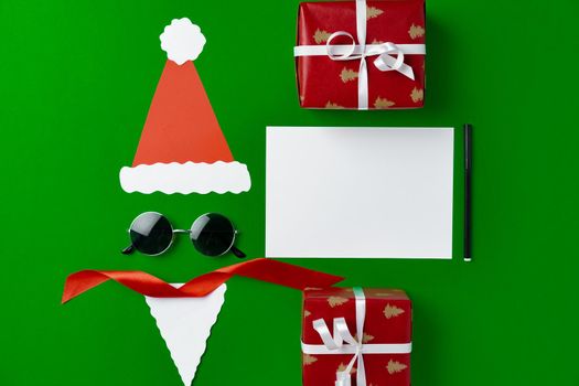Blank Christmas greeting card with festive decorations, top view