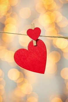 Happy Valentine day background with red hearts hang with clothespin on rope with bokeh background, romantic design, greeting card or copy space space for text