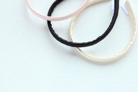 Flat lay Hairdressing tools and accessories as Color Hair Scrunchies, Elastic Hair Bands, Orbital Hair ring or hair hoop