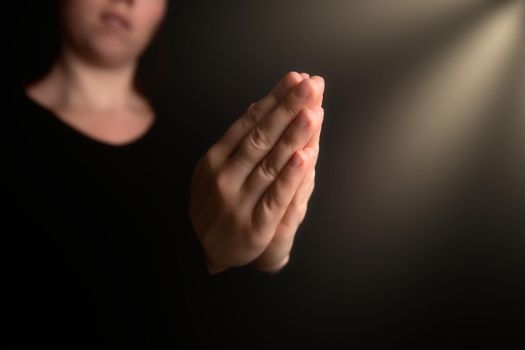 Praying hands with faith in religion and belief in God on blessing background. Power of hope or love and devotion in the dark with copy space , space for text