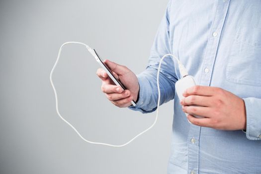 man is charging smartphone good