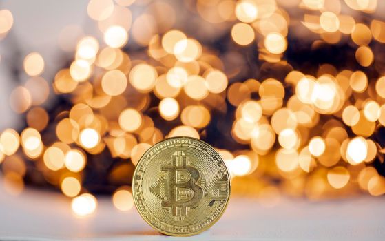 Golden bitcoin with yellow bokeh background. Cryptocurrency concept. Blockchain and digital crypto currency exchange concept. space for text copy space