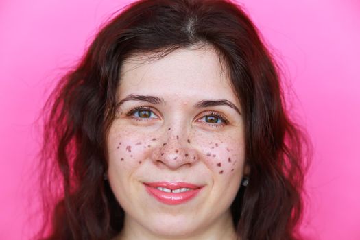 Portrait of bright beautiful girl with art colorful freckles make-up. Body positivity.