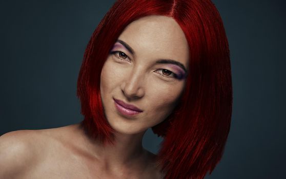 Portrait of beautiful smiling woman with red hairstyle on dark background