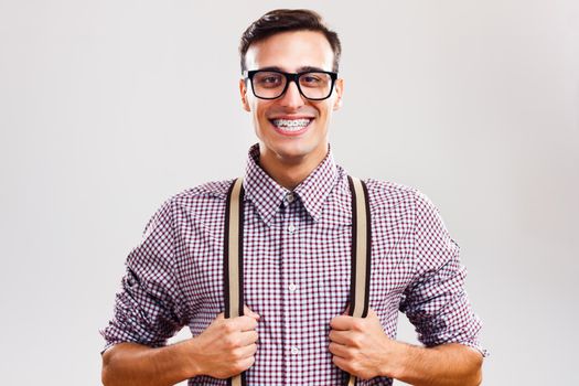 Portrait of happy handsome nerdy man.