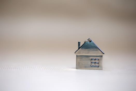 Little miniature house on blurred background, New home, Real Estate, Mortgage loan,architectural concept with Copy space space fot text