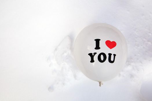 White Valentines Day balloon with the text I love you in fresh white snow background, Copy space, Love,winter,Valentine concept space for text