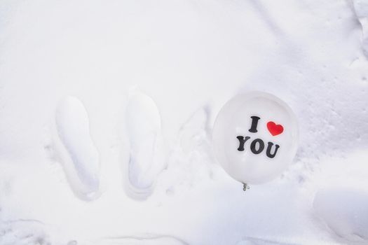 White Valentines Day balloon with the text I love you in fresh white snow background, Copy space, Love,winter,Valentine concept space for text