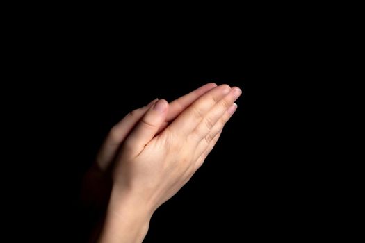 Praying hands with faith in religion and belief in God on blessing background. Power of hope or love and devotion in the dark with copy space , space for text