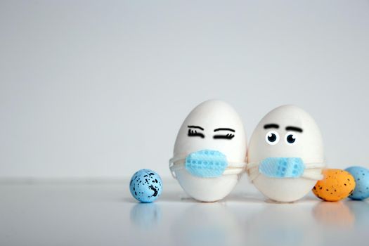 Easter eggs with Corona virus COVID19 protection concepts. DIY Do It Yourself easter eggs wearing mask for Easter holidays decoration on white background Selective focus with copy space. COVID-19 protection coronavirus