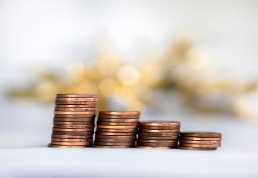 Stack of coins, money climbing stairs with bokeh background, Finance and saving concept with copy space growing business