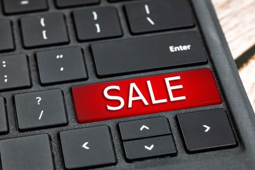 SALE written on black computer keyboard with red and white text, Shopping online,black Friday concept technology