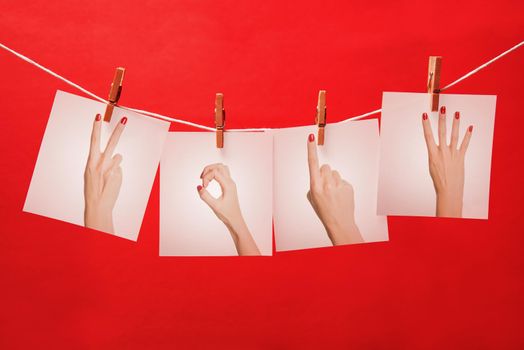 New year with female hands forming number 2014 on a red background