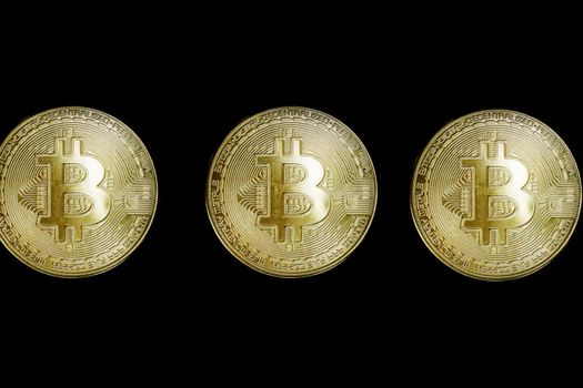 Golden bitcoin on black background with copy space. Cryptocurrency mining business concept virtual currency