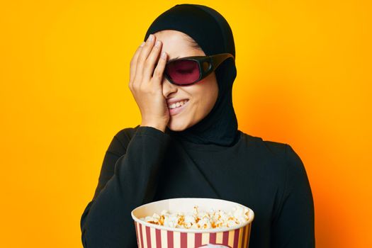 Muslim watching movies 3D glasses fun studio lifestyle. High quality photo