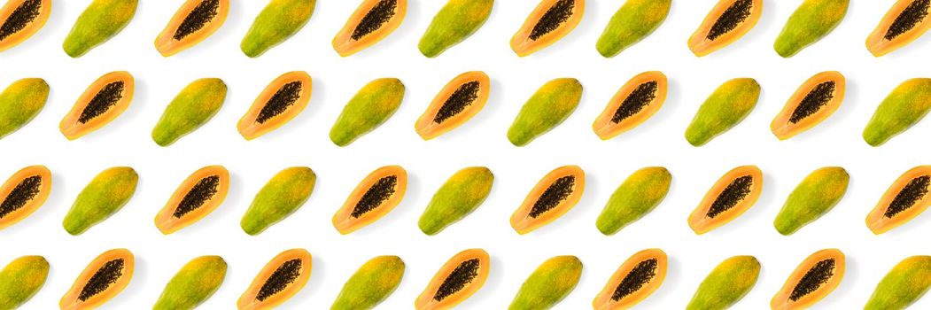 Fresh ripe papaya background on white backdrop. Modern tropical abstract background. Top view. Creative design, minimal flat lay concept. Trend tropical fruit food background - not seamless pattern