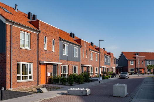 Dutch Suburban area with modern family houses, newly build modern family homes in the Netherlands, dutch family house, apartment house. Netherlands