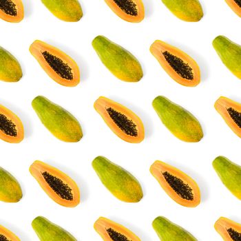 Fresh ripe papaya seamless pattern on white background. Tropical abstract background. Top view. Creative design, minimal flat lay concept. Trend tropical fruit food background pattern