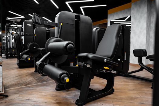 Modern gym interior with new fitness equipment, no people