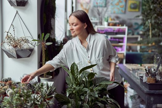 Portrait of caucasian female florist in its own florist shop